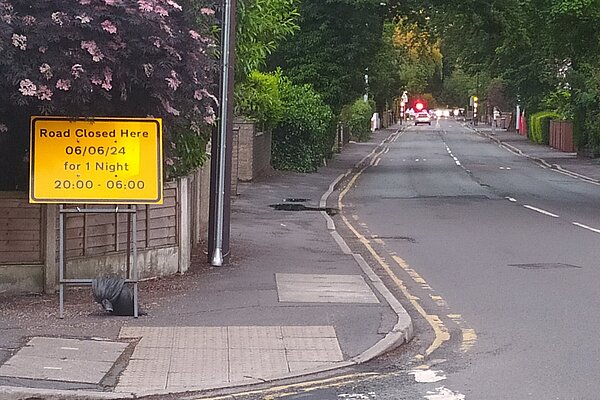 Road Closed sign, confirming the date of resrfacing to be June 6th Road Closed sign, confirming the date of resrfacing to be June 6th