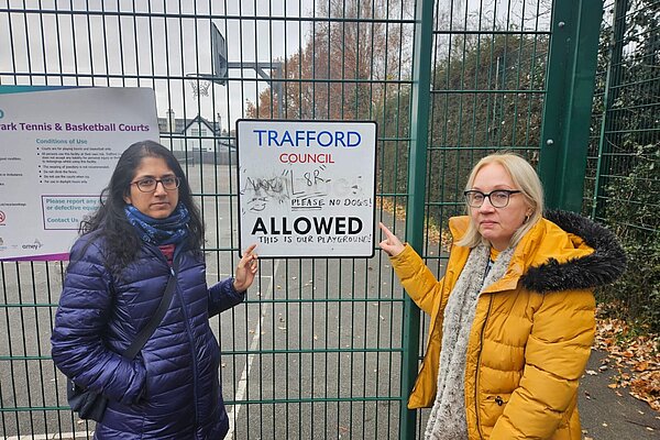 Cllrs Meena Minnis and Jane Brophy pointing at a sign with heavy graffiti Cllrs Meena Minnis and Jane Brophy pointing at a sign with heavy graffiti